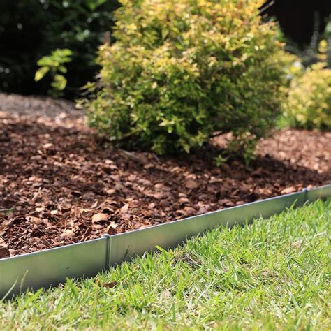 Metal landscape edging lowes - Standard 8 ft. sections create solid definition in any landscape design using 4 in. tall durable prime steel. Used for separating grass from beds, driveways, walkways and paths, or as a retainer for stone, mulch, or other filler material. Black powder coated finish maintains its look for years. 5 pack.